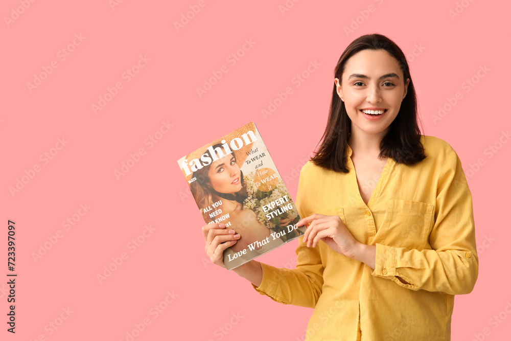 Beautiful woman with fashion magazine on pink background Beautiful woman with fashion magazine on pink background