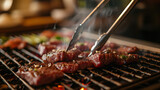Grilling beef steak on barbecue grill in restaurant, closeup view