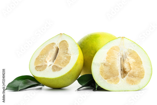 Fresh pomelo fruits and leaves on white background photo