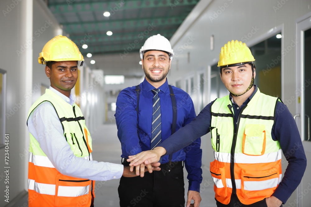 worker or engineer working in factory with safety uniform , safety hat and safety glasses , image is safety concept or happy workplace worker or engineer working in factory with safety uniform , safety hat and safety glasses , image is safety concept or happy workplace