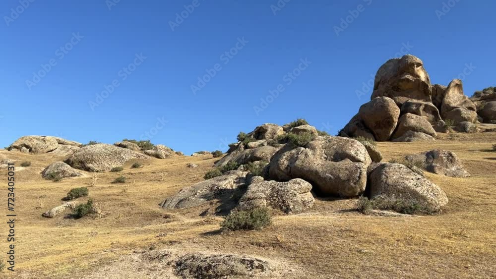 The Valley of Demons in Uzbekistan in the Samarkand region. Boulders, granite sculptures, huge boulders of bizarre shapes in the spurs of the Zaravshansky ridge. 4K Video The Valley of Demons in Uzbekistan in the Samarkand region. Boulders, granite sculptures, huge boulders of bizarre shapes in the spurs of the Zaravshansky ridge. 4K Video