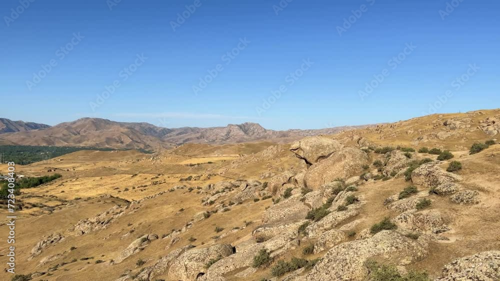 The Valley of Demons in Uzbekistan in the Samarkand region. Boulders, granite sculptures, huge boulders of bizarre shapes in the spurs of the Zaravshansky ridge. 4K Video The Valley of Demons in Uzbekistan in the Samarkand region. Boulders, granite sculptures, huge boulders of bizarre shapes in the spurs of the Zaravshansky ridge. 4K Video