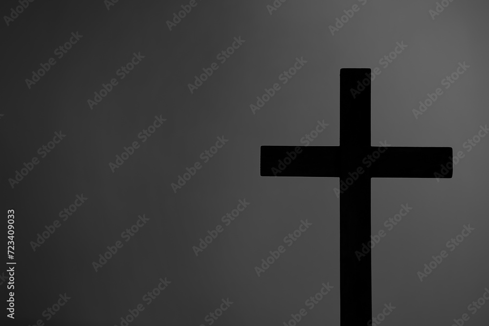 Wooden cross on grey background. Good Friday concept