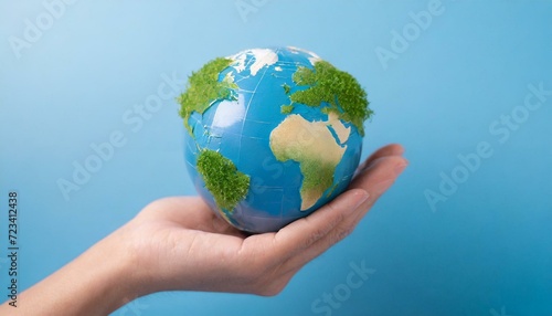 Concept of Sustainable development, eco friendly with hand and planet Earth globe. 