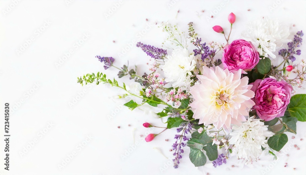 Fototapeta premium Festive flower composition on the white background. Overhead view 