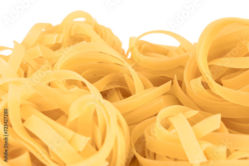 Traditional fettuccine ribbons pattern background, large detailed isolated horizontal raw dry long uncooked egg pasta macro closeup, natural golden texture perspective, blank empty white copy space