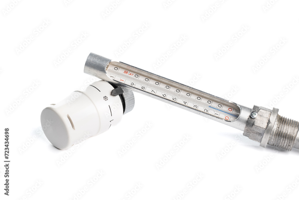 White head for the thermostatic valve and a metal mercury metal thermometer insulated on a white background, close -up. (selective focus) White head for the thermostatic valve and a metal mercury metal thermometer insulated on a white background, close -up. (selective focus)