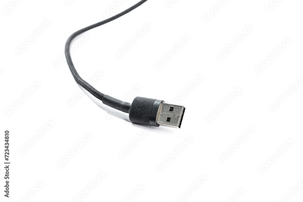 Black USB braided cable - Lightning isolated on a white background, close -up. (selective focus) Black USB braided cable - Lightning isolated on a white background, close -up. (selective focus)