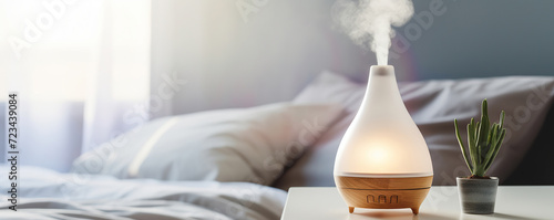 Aromatic lamp modern humidifier, aromatherapy steam scent from essential oil diffuser in bed room, apartment, hotel photo