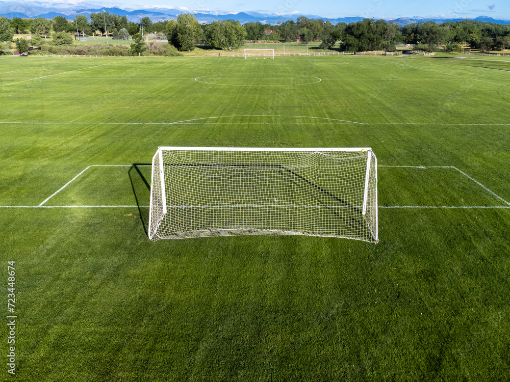Fototapeta premium Aerial view of soccer field with goal in foreground