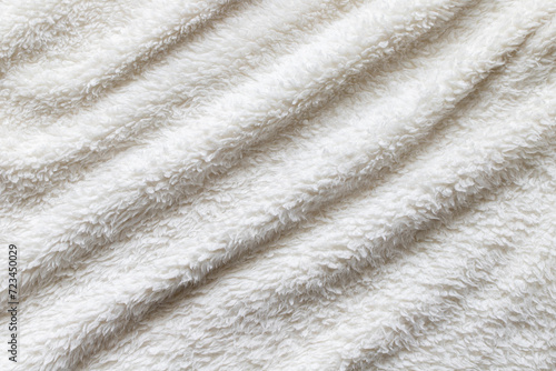 White plush fabric throw. Warm blanket background