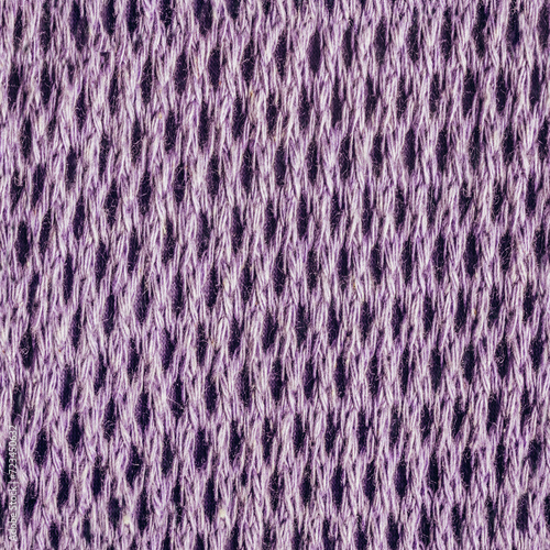 Seamless texture photo of purple lavander colored wool net sweater material.