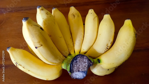 fresh bananas, ripe yellow fruit that is ready to eat. photo