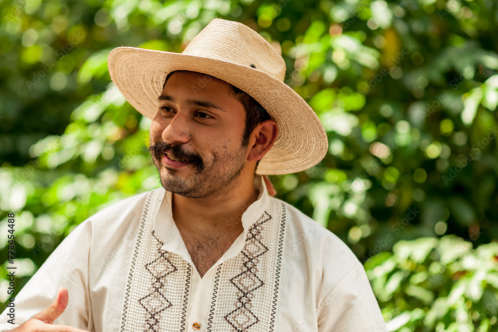 Happy farmer in his coffee plantation.