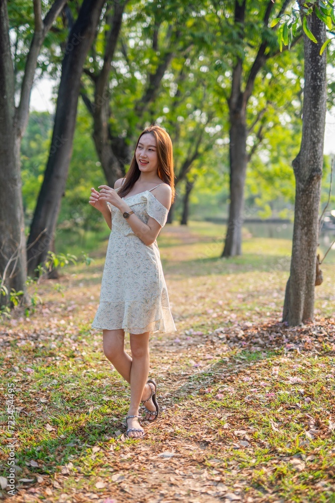 Beautiful woman casually enjoy sun breeze in a park Beautiful woman casually enjoy sun breeze in a park