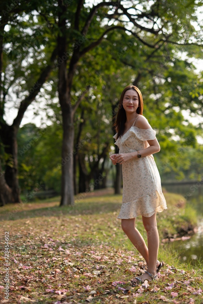 Beautiful woman casually enjoy sun breeze in a park Beautiful woman casually enjoy sun breeze in a park