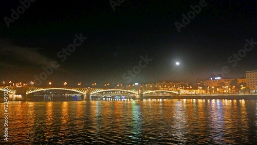 Hungary Budapest night sailing and view of Buildings infrastructures bridges landmarks in the city along Rhine river and Danube river 