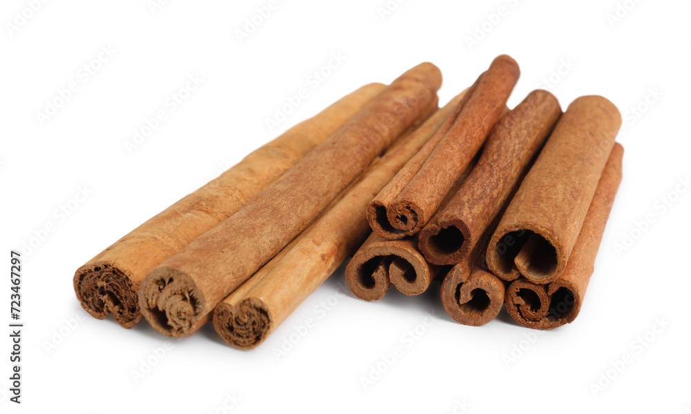 Dry aromatic cinnamon sticks isolated on white Dry aromatic cinnamon sticks isolated on white