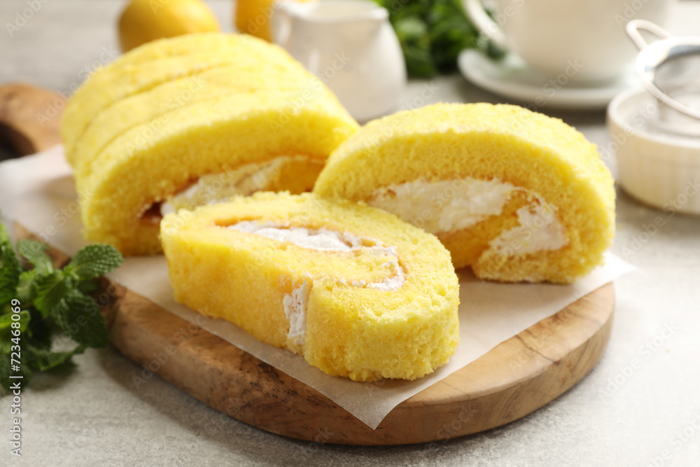 Delicious cake roll with cream filling on table, closeup Delicious cake roll with cream filling on table, closeup