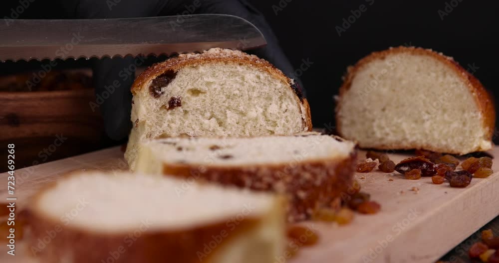 sweet wheat bun with raisins on the table, sweet bun with golden raisins sweet wheat bun with raisins on the table, sweet bun with golden raisins
