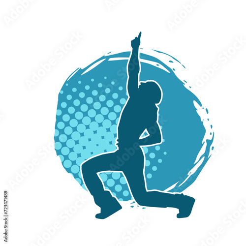Silhouette of a man in dancing pose. Silhouette of a male dancer in performing pose.