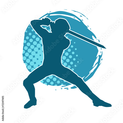 Silhouette of a male warrior in action pose with sword weapon. Silhouette of a man fighter carrying sword weapon.