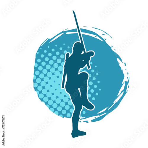 Silhouette of a male warrior in action pose with sword weapon. Silhouette of a man fighter carrying sword weapon.