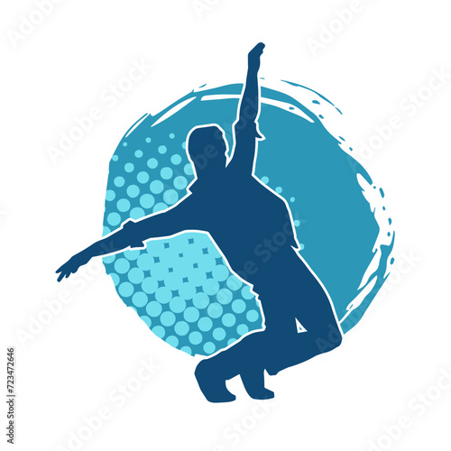Silhouette of a slim man dancing pose. Silhouette of a male dancer in action pose.