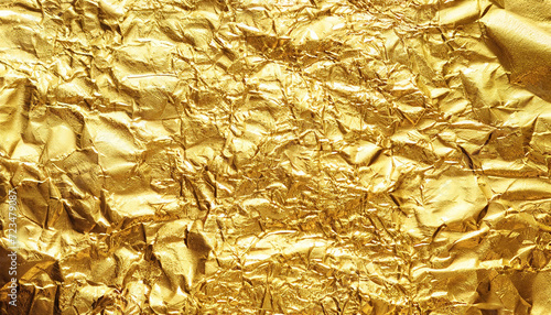 gold foil background with shiny crumpled surface for texture background