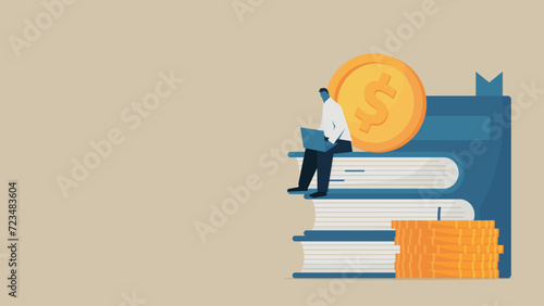 A man using a laptop on top of a book. There are coins around the book.