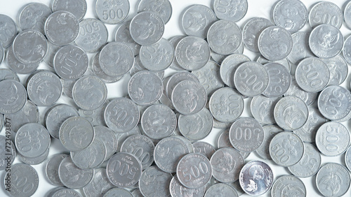 collection of Indonesian rupiah coins on a white background.