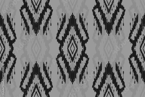 Fabric ethnic ikat art. Seamless pattern in tribal. Aztec geometric ornament print. Design for background, wallpaper, illustration, fabric, clothing, carpet, textile, batik, embroidery.