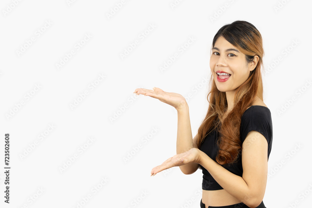 Portrait of young asian woman long hair style smiling and hands pointing presenting isolated on white background. Emotional face. Portrait of young asian woman long hair style smiling and hands pointing presenting isolated on white background. Emotional face.