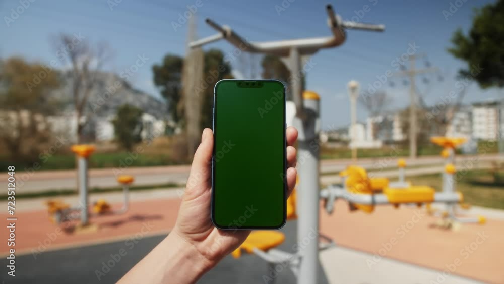 Green Screen chroma key Handheld Smartphone. Travel with phone concept, application mock up. Sunset on a tropical beach. Green Screen chroma key Handheld Smartphone. Travel with phone concept, application mock up. Sunset on a tropical beach.