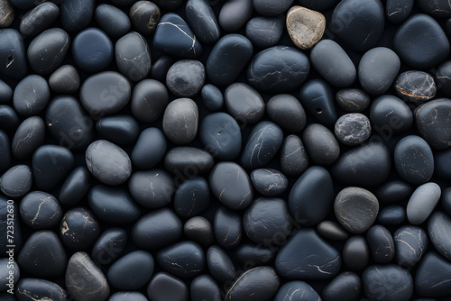 Black and white pebbles background. Top view, flat lay.