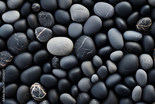 Black and white pebbles background. Top view, flat lay.