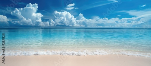 Serenely blue sky and tranquil beach.