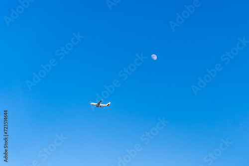 airplane flying over sky moon