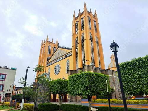 Parish of San Juan Bautista in front of the gardens of the plaza in the center of the magical town Xicotepec Puebla Mexico