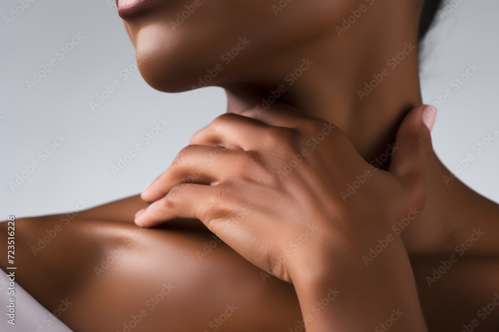 Fototapeta premium Close-Up of a Graceful Woman Touching Her Neck. Beauty and Skincare Concept