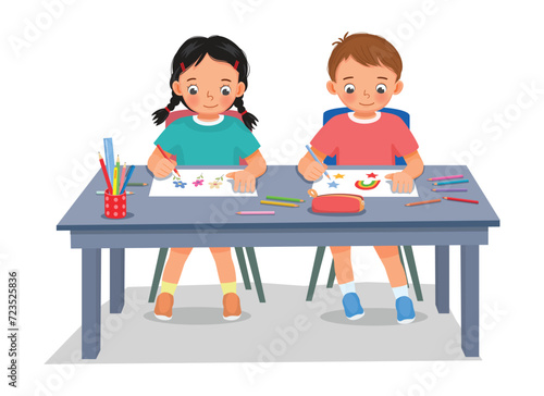 Cute kids students drawing picture at the table together