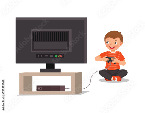 Cute little boy playing video game