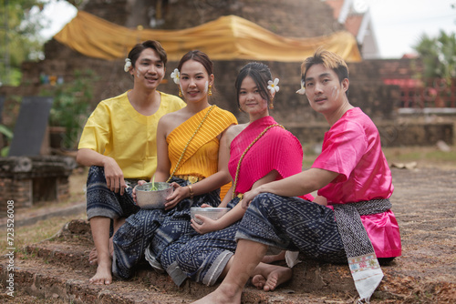 Songkran Day, young Thai people wear Thai clothes and celebrate on Songkran Day. photo