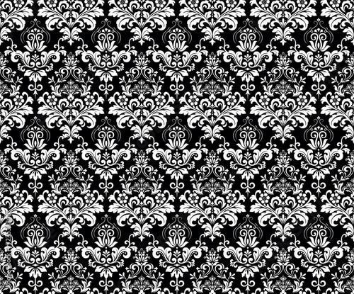 Wallpaper in the style of Baroque. Seamless vector background. White and black floral ornament. Graphic pattern for fabric, wallpaper, packaging. Ornate Damask flower ornament