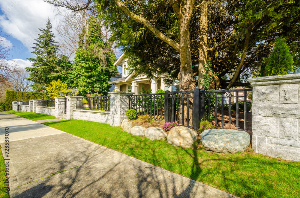 two story stucco luxury house with nice summer  landscape in Vancouver, Canada, North America.