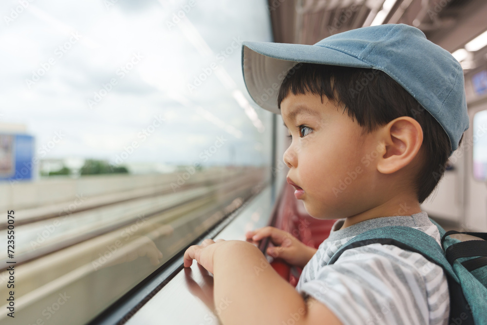© eggeeggjiew - Asian Japanese boy in commuter train. © eggeeggjiew - Asian Japanese boy in commuter train.