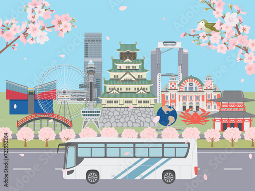 春の大阪の街並みを走るバス