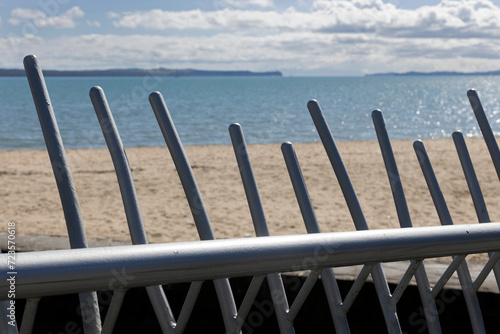 Gate at  beach of Kohimarama beach Mission bay. Coast Auckland New Zealand.  photo