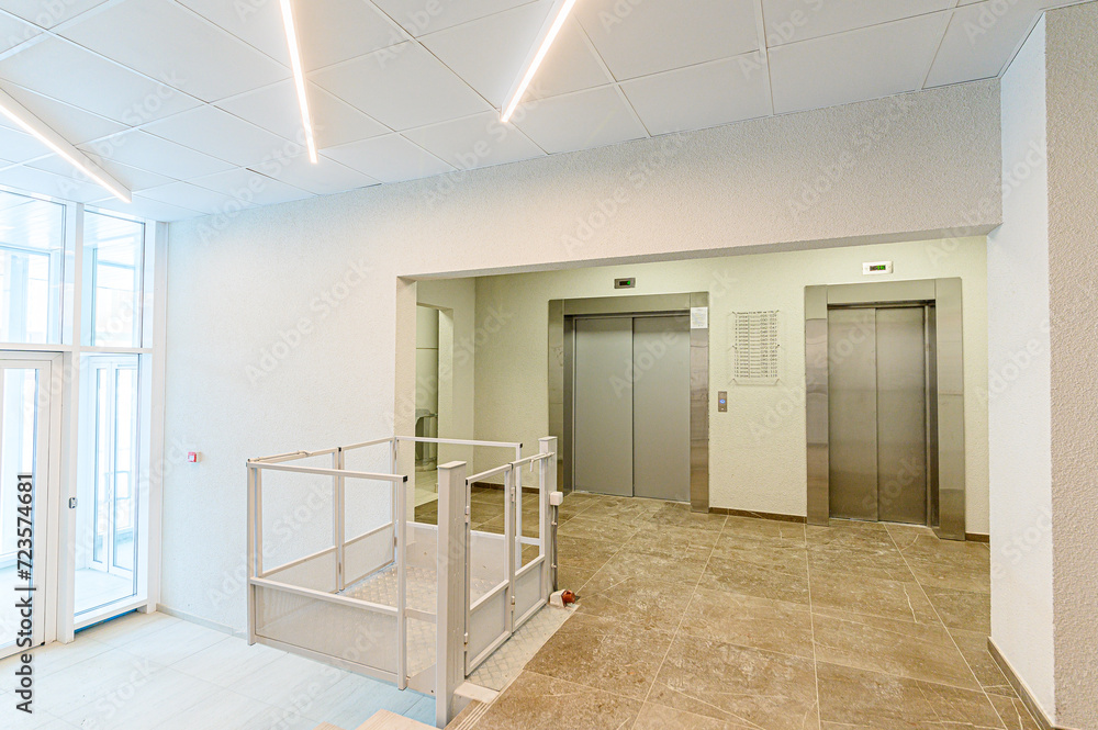 Fototapeta premium interior public place, house entrance. doors, walls, corridors staircase