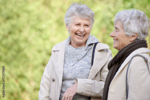 Senior friends, comic and laughing in nature for reunion, together and funny chat for trip in outdoor. Elderly women, joke and silly discussion on travel vacation in england, care and social in park